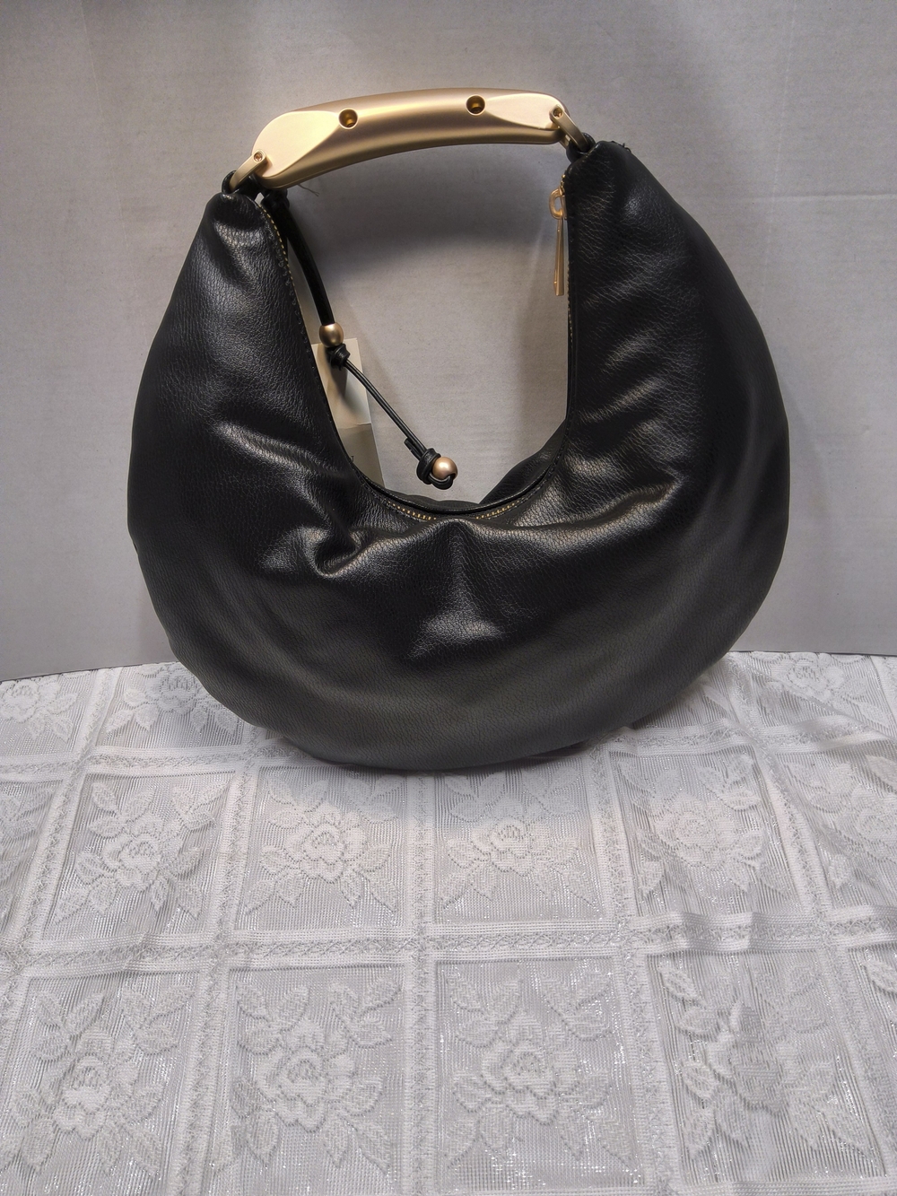 A New Day Crescent Handle Bag in Black with Gold Accent